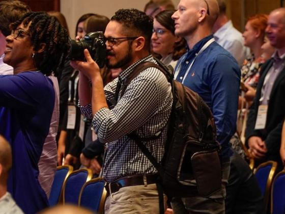 Christian Monterrosa of the ONA Student Newsroom photographs the opening of #ONA17 conference in Washington, D.C. (Photo: Curt Chandler)
