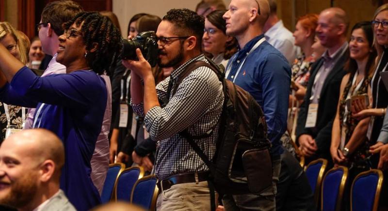 Christian Monterrosa of the ONA Student Newsroom photographs the opening of #ONA17 conference in Washington, D.C. (Photo: Curt Chandler)