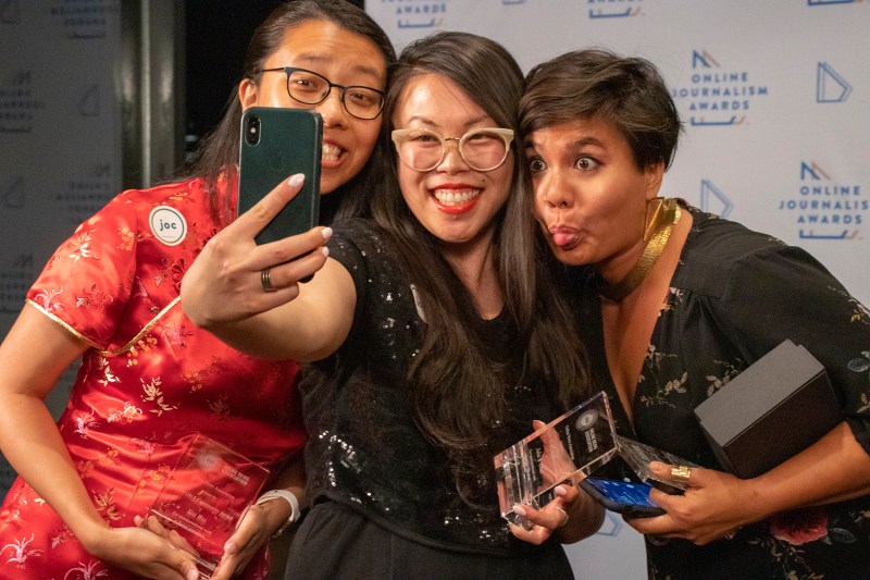 Sisi Wei, Julia B. Chan and Lam Thuy Vo make a selfie in the red carpet area after their team, Journalists of Color Slack Administrators, won the ONA Community Award at the 2019 Online Journalism Awards. Photo by Daja Henry